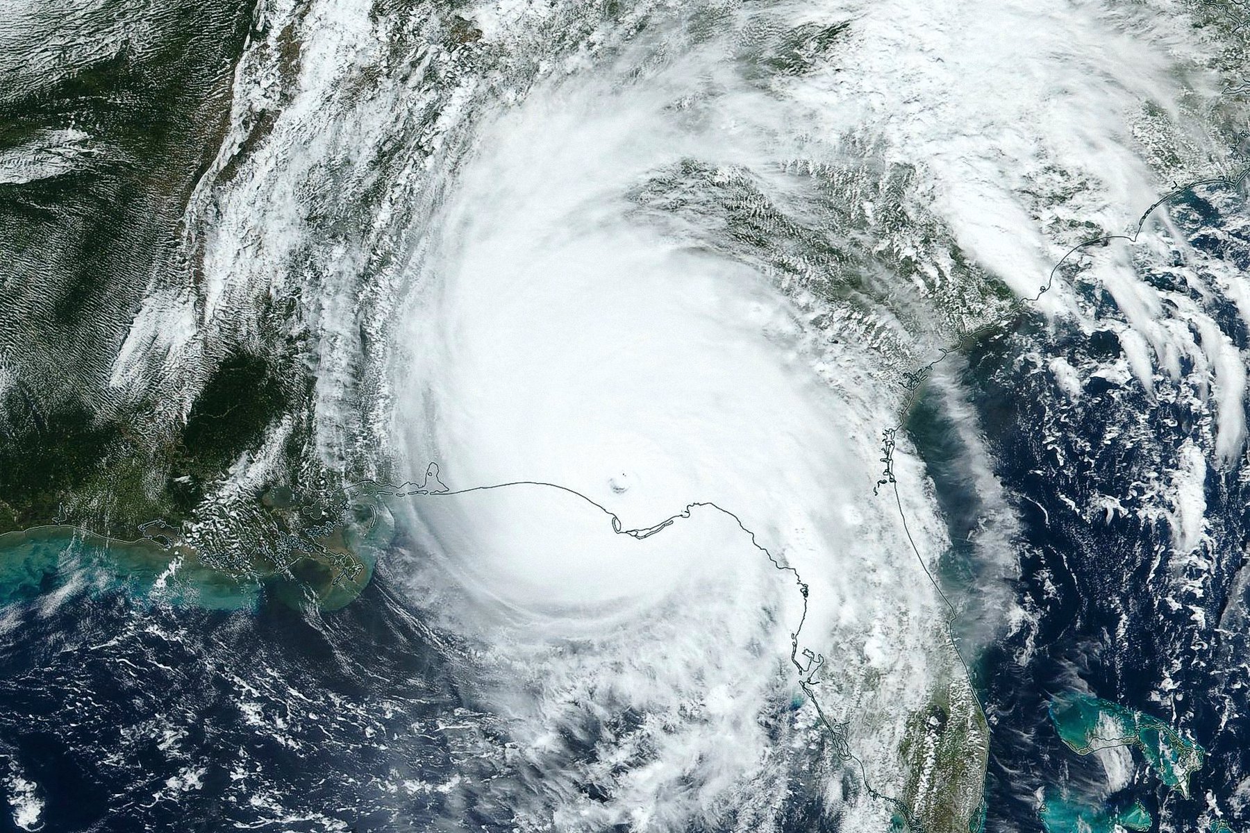 Hurricane Michael storms swirling about the panhandle as seejn from above, desktop view